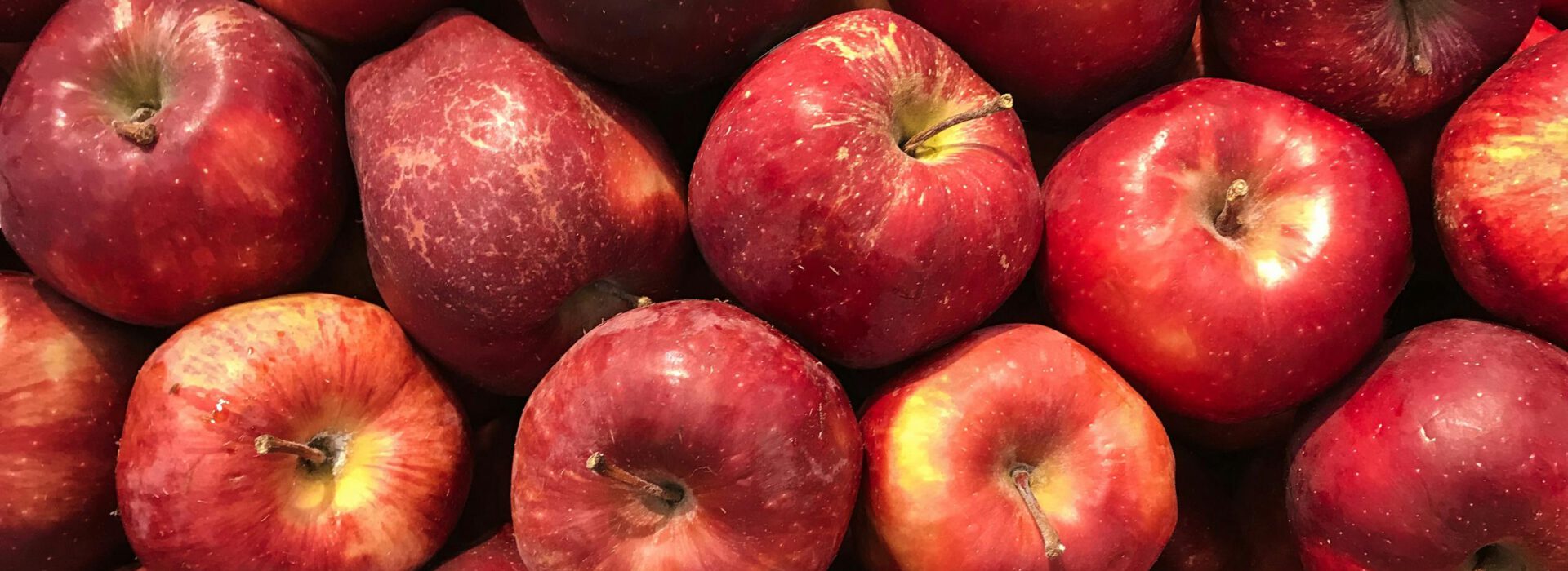 A vibrant collection of fresh red apples showcasing healthy abundance.